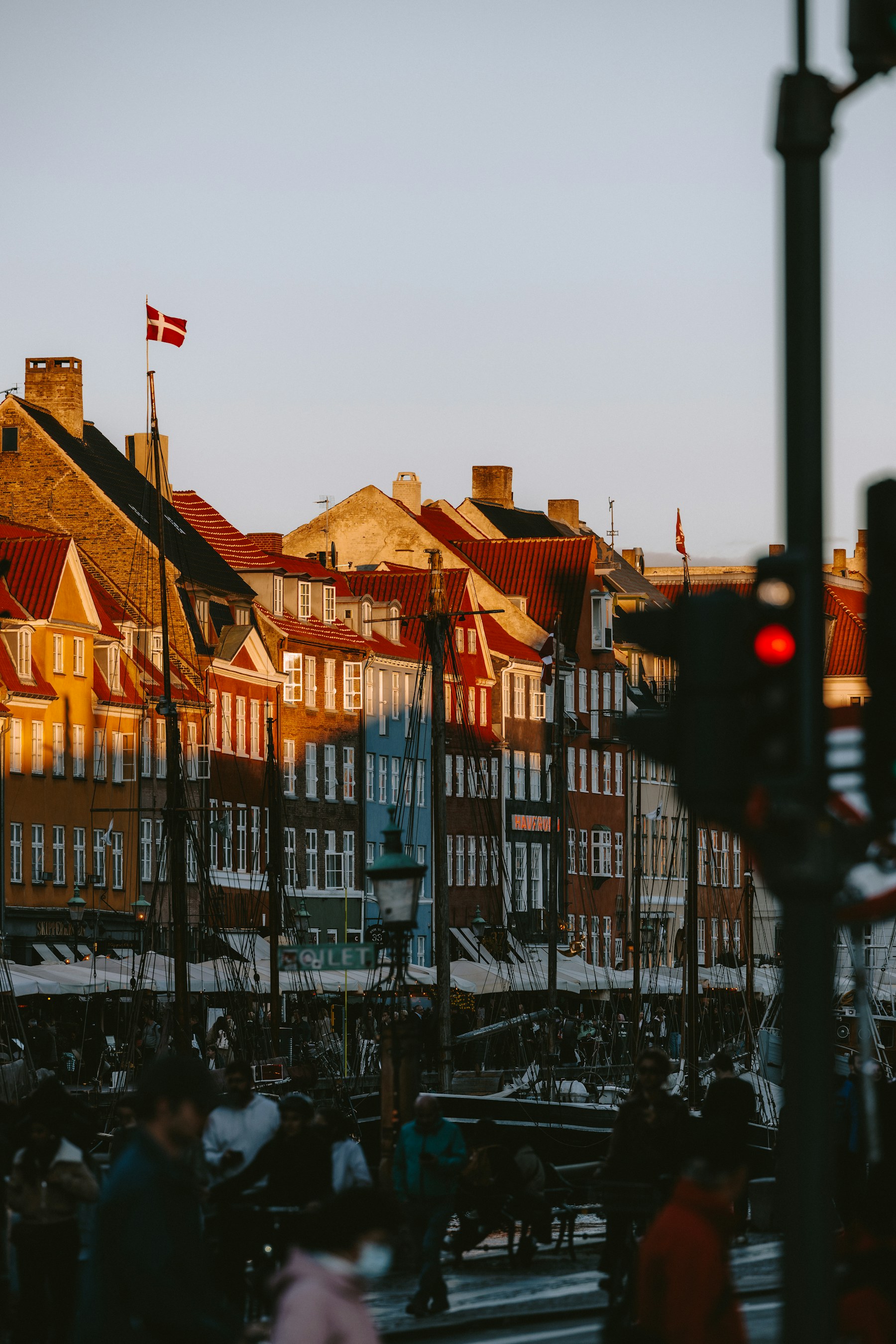 Nyhavn's colorful canal houses and boats at sunset